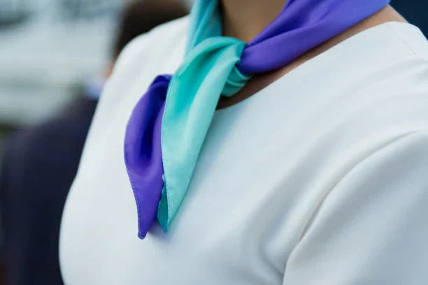 How a Silk Scarf Enhances Neutral Coat Colors with Subtle Elegance